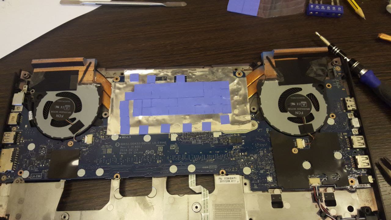 Thermal pads added to the back of the motherboard to use the metal body of the laptop as a huge heatsink