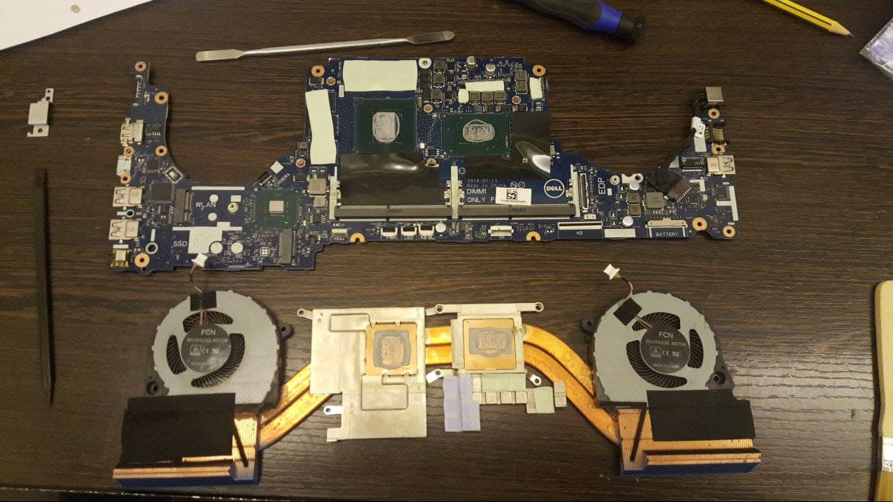 Motherboard and heatsink showing thermal pads and thermal paste stock condition